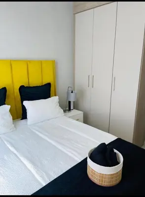 a bedroom with a bed with a basket on it at Dubai 8 in Midrand