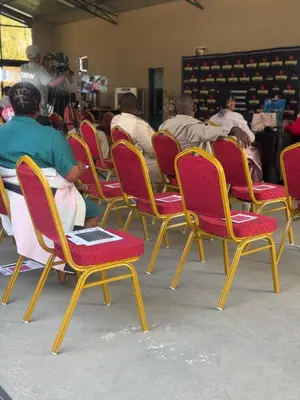 a group of people sitting in chairs in a room at Monet Guesthouse in Marble Hall