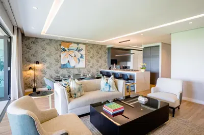 a living room with a couch and a table at Steyn City Hotel by Saxon in Midrand