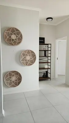 three circles on the wall in a white room at Lizzy's Residence in Midrand