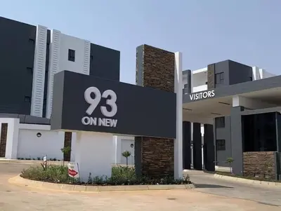 a building with a sign that reads on new at Lizzy's Residence in Midrand