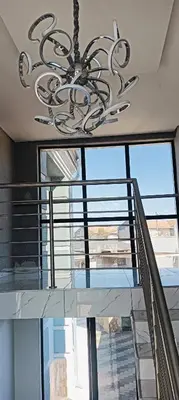 a chandelier hanging from the ceiling in a building at Duplessis Lodge in Kempton Park