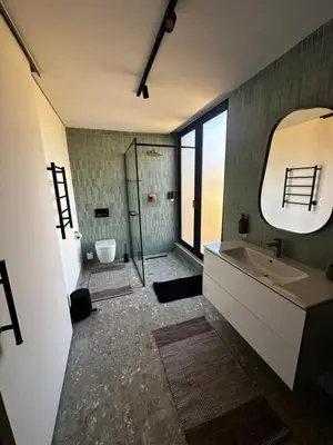 a bathroom with a sink and a toilet and a mirror at Rattlesnake Weir in Dullstroom
