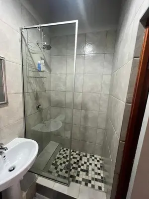 a bathroom with a shower and a sink at Two Firs Irene in Centurion