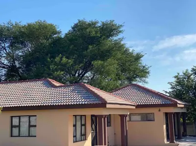 a house with a tiled roof on top of it at SummerPlace - Studio Apartment with Kitchenette in Modimolle