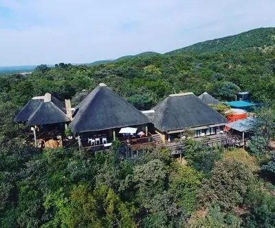 a group of huts on top of a hill at Mokaikai - The Soaring Eagle in Mabula