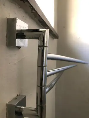 a metal object is hanging on a wall at Esibayeni Guesthouse in Nelspruit