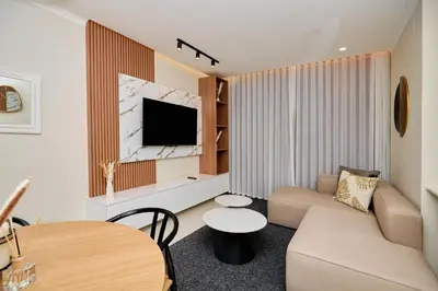 a living room with a couch and a table at The Dream, Unit N105 at Glen Park in Pretoria