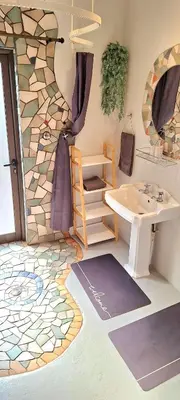 a bathroom with a sink and a mirror at Stay at Fairway in Centurion
