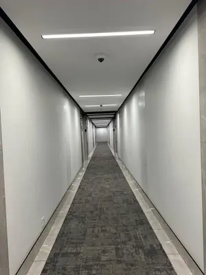 a corridor in an office building with a long hallway at Luna luxury apartment in Midrand