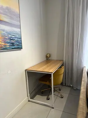 a desk with a wooden top in a room at Luna luxury apartment in Midrand