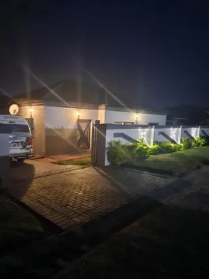 a van parked in front of a house at night at Buffalo guest lodge in Bushbuckridge