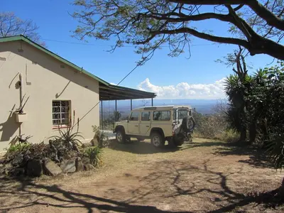 a jeep parked in front of a house at Bushwhacked Barberton in Barberton