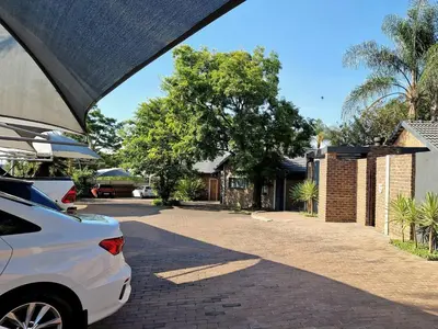 a white car parked in front of a house at Menlyn View Unit 6 in Pretoria