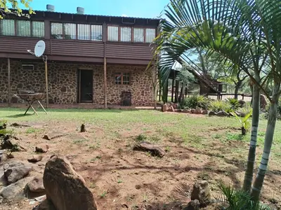 a stone building with a palm tree in front of it at 41onLeo in Eersbewoond