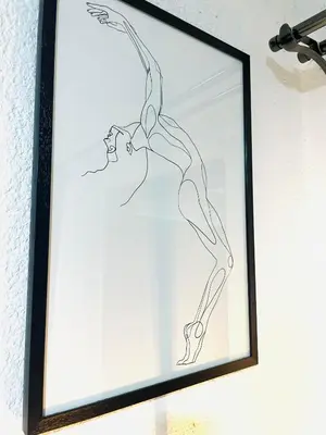 a framed drawing of a woman in a dance pose at Makgobelo Lodge -The White House - Solar powered in Ga-Mokalapa