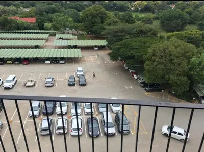 an aerial view of a parking lot with cars at Circa Lynwood flats,unit 223 Menlyn in Pretoria