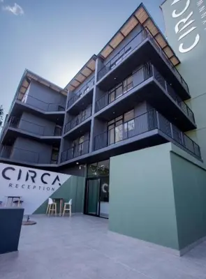 a building with a white sign in front of it at Circa Lynwood flats,unit 223 Menlyn in Pretoria
