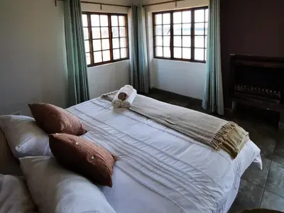 a large bed with a towel on top of it at Troutmere in Belfast