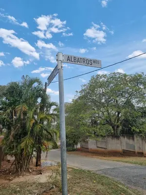 a street sign on a pole on a road at Leetong Holiday Home in Hazyview