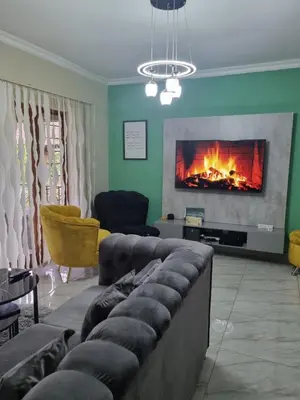 a living room with a couch and a fireplace at Leetong Holiday Home in Hazyview