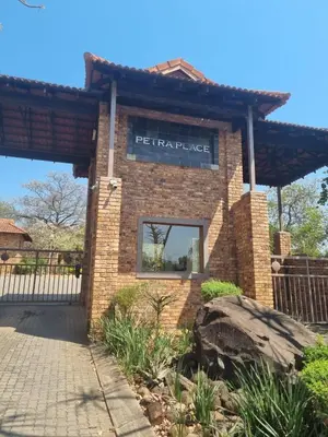 a brick building with a sign that reads philadelphia at Leetong Holiday Home in Hazyview