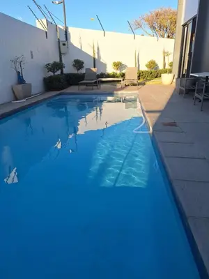 a swimming pool with blue water in a house at Zalari Luxe 93 on New, Carlswald, Midrand in Midrand