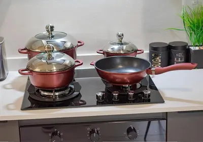 two pots and pans sitting on top of a stove at Zalari Luxe 93 on New, Carlswald, Midrand in Midrand