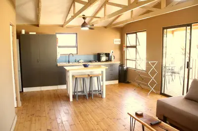 a kitchen with a counter and a sink in a room at Romantic cabin in Big 5 Reserve in Dinokeng Game Reserve