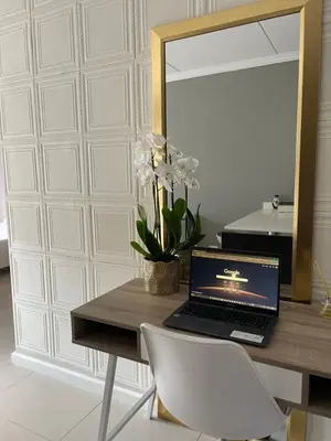 a desk with a laptop computer on top of it at 1 Bedroom Sleek, Spotless, Work-from-home Sanctuary in Midrand