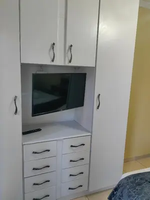 a white cabinet with a tv on top of it at Choosers Express Boutique Hotel Room 4 in Centurion