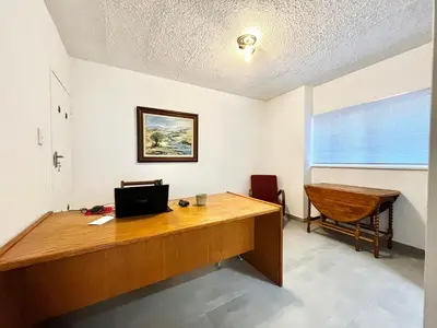 an office with a wooden desk and a chair at Thornhill Tranquility in Pretoria