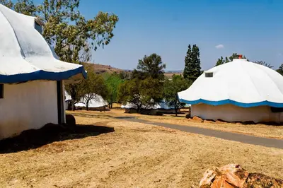a couple of buildings with a white and blue roof at Kianga Lodge & Venue in Centurion