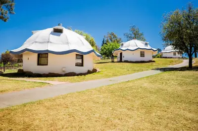 two buildings with domes on top of a field at Kianga Lodge & Venue in Centurion