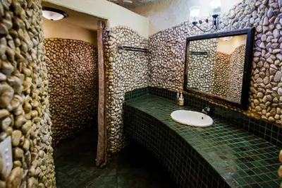 a bathroom with a sink and a mirror at Kianga Lodge & Venue in Centurion