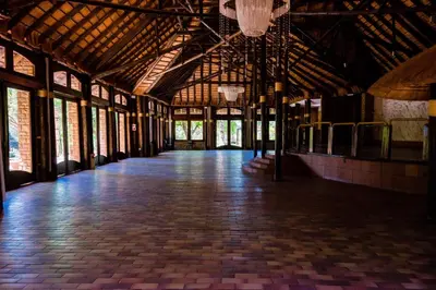 a large room with a wooden floor and windows at Kianga Lodge & Venue in Centurion