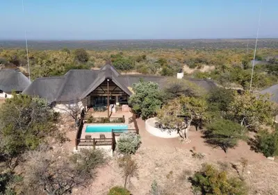 an overhead view of a house with a swimming pool at 205 Zebula 4 Bedroom with 2 bedroom Cottage in Mabula