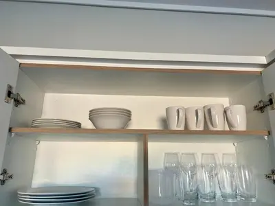 a shelf with dishes and glasses on it at The Blyde Bliss in Pretoria