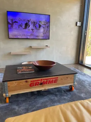 a coffee table with a bowl on top of it at Modern Apartment on Letaba River in Tzaneen