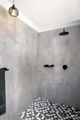 a bathroom with a black and white checkered floor at Woman Era Guesthouse in Midrand