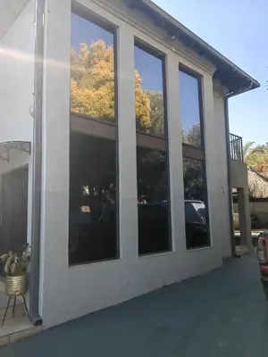 a group of windows on the side of a house at Choosers Express Boutique Hotel Room 3 in Centurion