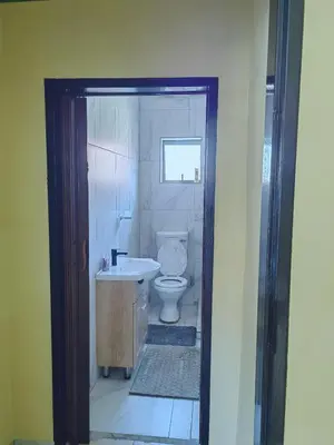 a bathroom with a toilet and a sink at Choosers Express Boutique Hotel Room 3 in Centurion