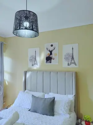 a bedroom with a white bed and a chandelier at Choosers Express Boutique Hotel Room 3 in Centurion