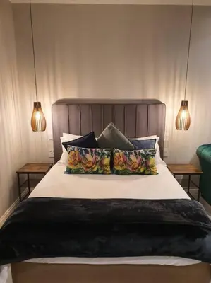 a bedroom with a large bed with pillows at Silver Views Guest Suite - No loadshedding! in Pretoria