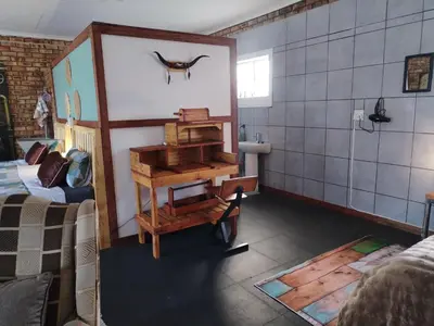 a room with a harpsichord on the wall at 2K City Studios Not Self catering in Graskop
