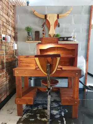 a wooden desk with a chair in a room at 2K City Studios Not Self catering in Graskop