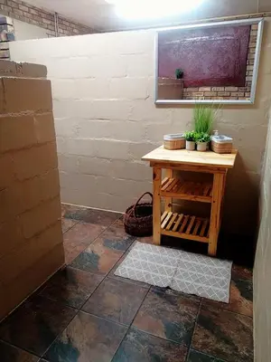 a room with a table with plants on it at 2K City Studios Not Self catering in Graskop
