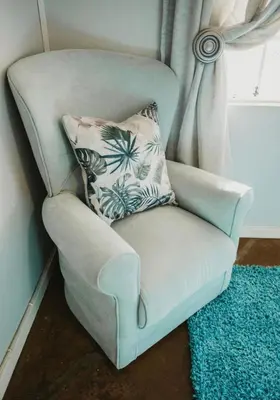 a chair with a pillow in a room at BelofteBos Farmhouse Inn in Bandelierkop
