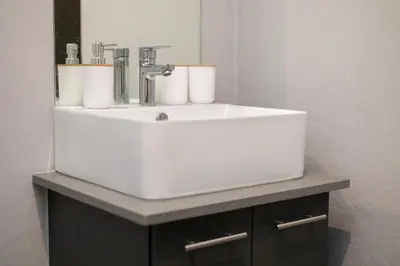 a white sink sitting on a counter in a bathroom at Stylish Stunner in Circa 205 in Pretoria