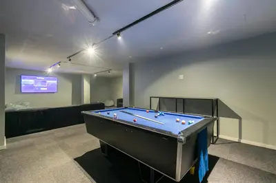 a room with a pool table and a tv at Stylish Stunner in Circa 205 in Pretoria